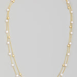 Pearl And Metallic Station Bead Layered Necklace In Gold - Infinity Raine