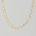 Pearl And Metallic Station Bead Layered Necklace In Gold - Infinity Raine