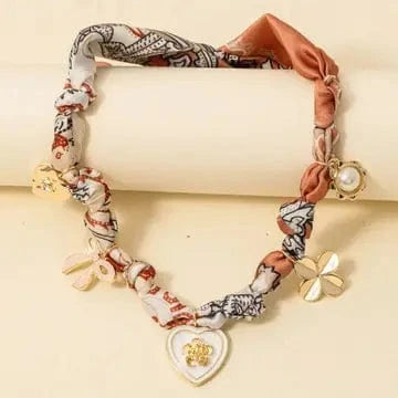 Ribbon Charm Necklace In Salmon - Infinity Raine