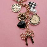 Bow Checker Heart Flower Bag Charm In Gold - Infinity Raine