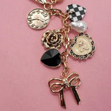 Bow Checker Heart Flower Bag Charm In Gold - Infinity Raine