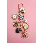 Bow Checker Heart Flower Bag Charm In Gold - Infinity Raine
