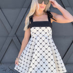 Fit And Flare Textured Bow Dress In Ivory - Infinity Raine