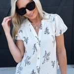 Floral Line Split Neck Button Down Top In Natural - Infinity Raine