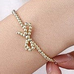 18k Tarnish Free Bow Bracelet In Gold - Infinity Raine