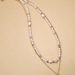 Layered Pearl Bow Necklace In Gold - Infinity Raine