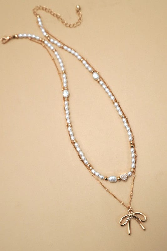 Layered Pearl Bow Necklace In Gold - Infinity Raine