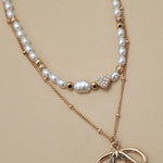 Layered Pearl Bow Necklace In Gold - Infinity Raine