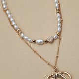 Layered Pearl Bow Necklace In Gold - Infinity Raine