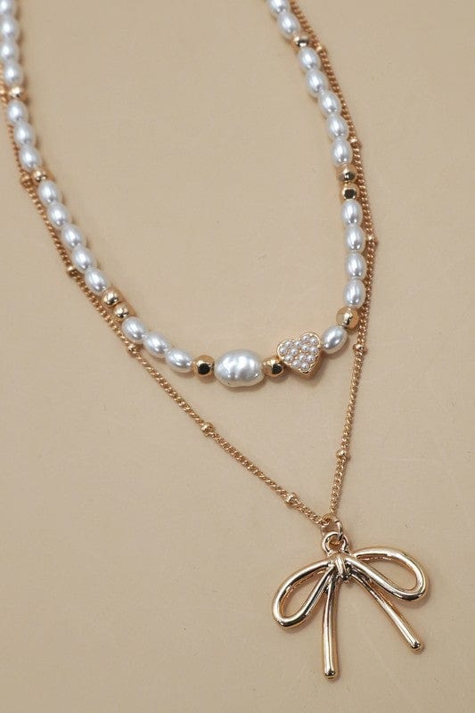 Layered Pearl Bow Necklace In Gold - Infinity Raine