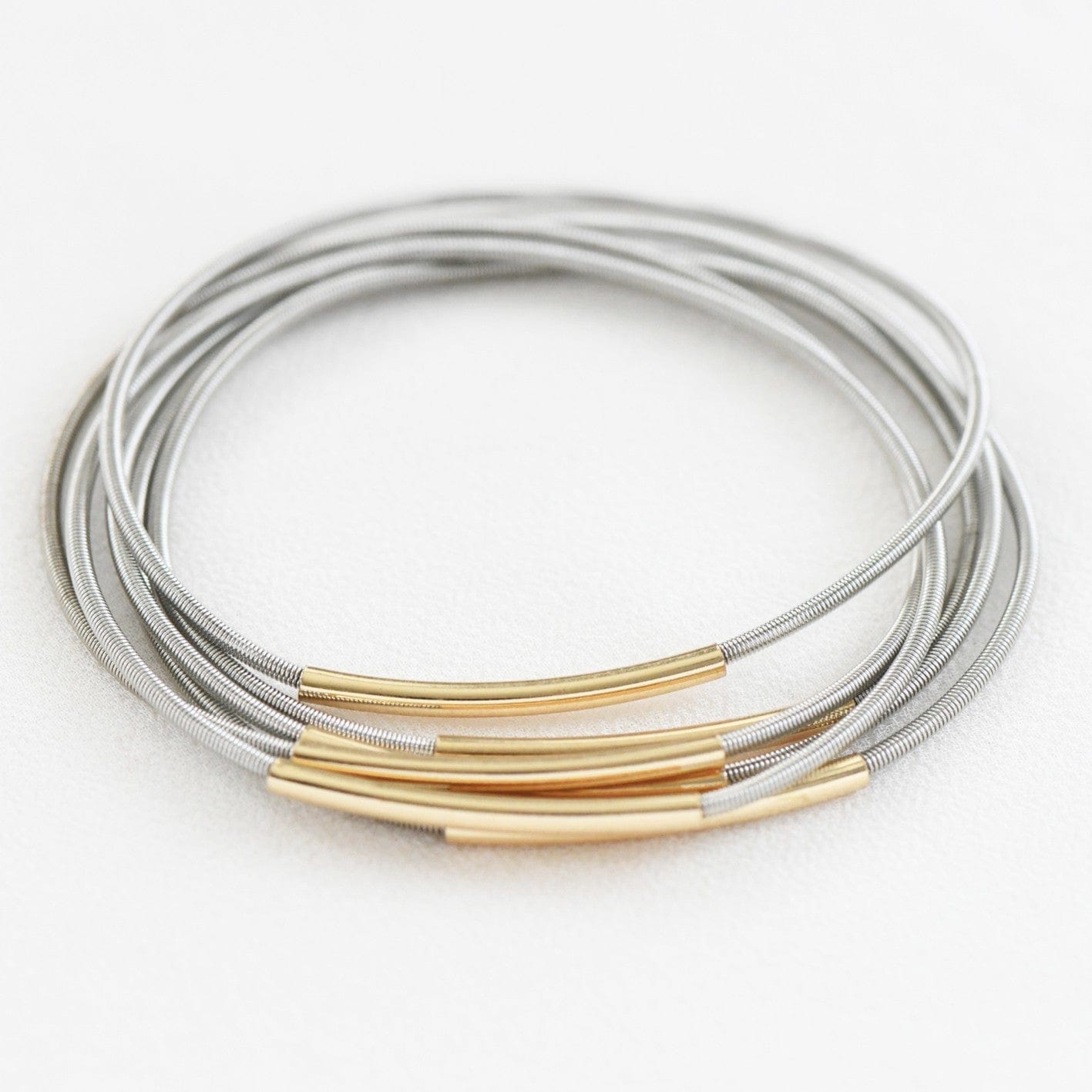 Stretchy Layered Guitar String Bracelet Set In Silver - Infinity Raine
