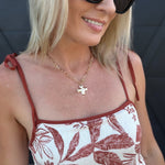Notable Hammered Cross Front Toggle Necklace In Gold - Infinity Raine