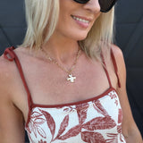 Notable Hammered Cross Front Toggle Necklace In Gold - Infinity Raine