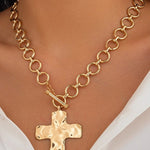 Notable Hammered Cross Front Toggle Necklace In Gold - Infinity Raine
